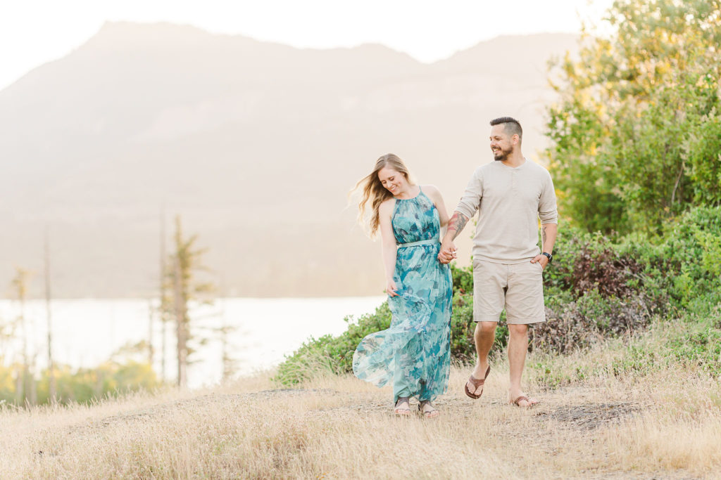 photo of couple walking at columbia river gorge
